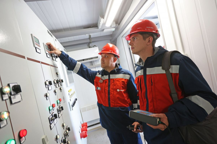 Engineers viewing switchgear