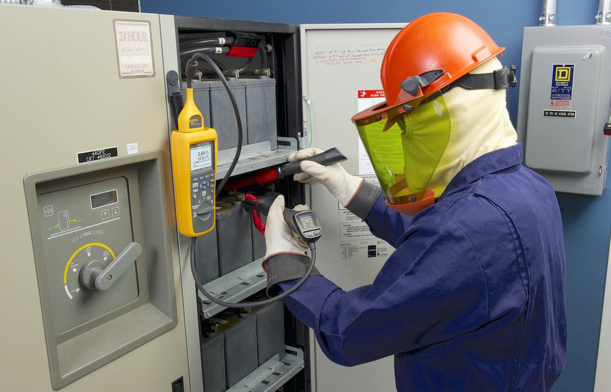 Engineer testing backup batteries