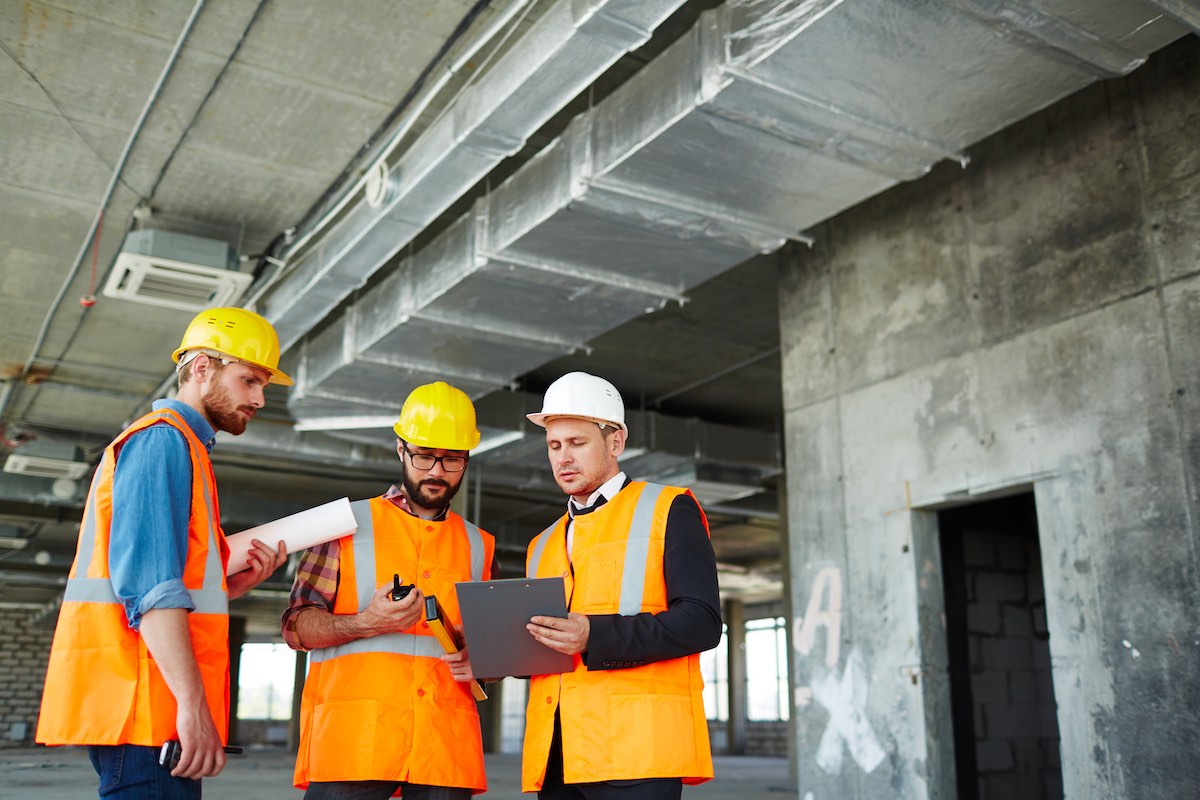 Construction workers discussing plans