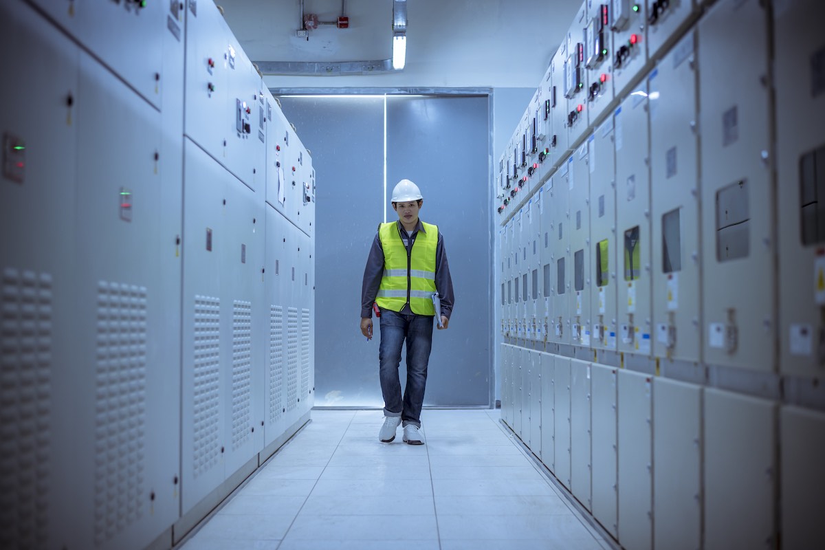 Engineer walking in switchroom