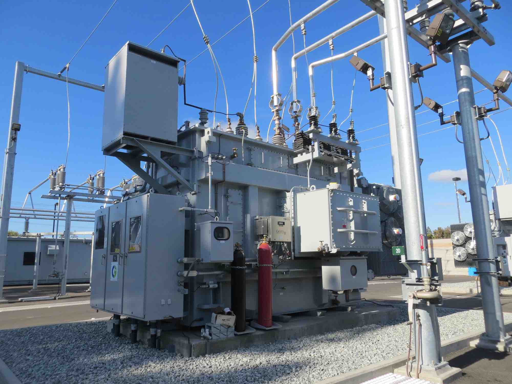 Technician performing transformer oil test